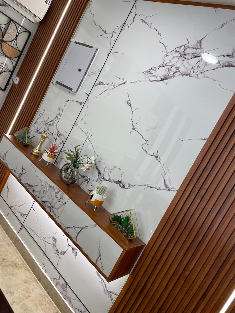 Custom TV unit wall with vertical wood slats and lighting